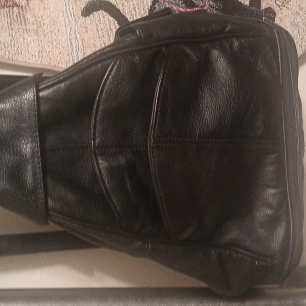 A Black Leather Backpack By Transetter
